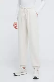 New Balance pantaloni de trening din bumbac culoarea bej, neted imagine