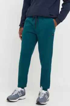 Rip Curl pantaloni de trening barbati, culoarea verde, neted imagine