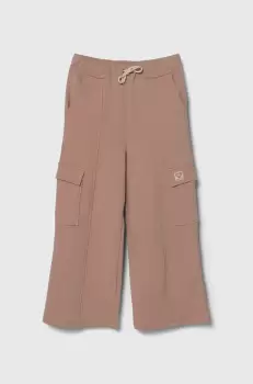 United Colors of Benetton pantaloni de trening din bumbac pentru copii culoarea bej, neted imagine