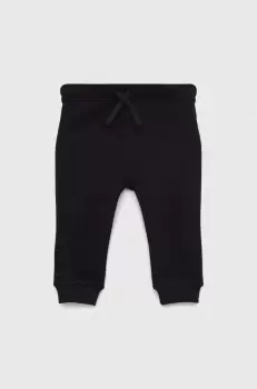 United Colors of Benetton pantaloni de trening din bumbac pentru copii culoarea negru, neted imagine