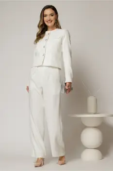Pantaloni albi cu croi larg si inchidere cu nasturi imagine