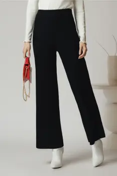 Pantaloni casual din tricot reiat negri evazati cu elastic in talie imagine