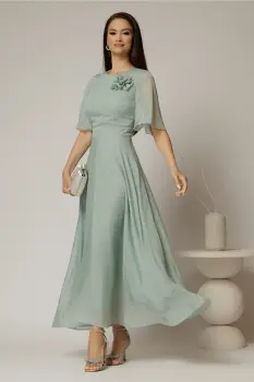 Rochie DY Fashion lunga verde menta din voal cu fir lurex in clos cu accesoriu la bust imagine