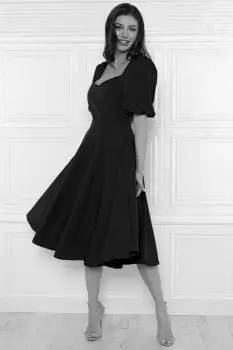 Rochie eleganta neagra din material vaporos cu croi in clos si buzunare laterale imagine