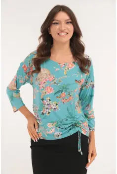 Bluza aqua cu print floral si cu siret lateral imagine